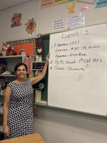 Alvidrez standing beside her lesson plans for Spanish 3. Photo credits to Lina Shahsavari