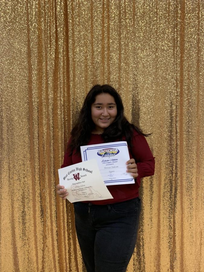 Falcon posing at the annual banquet with her accomplishments of making it into the notorious Hacienda League. 