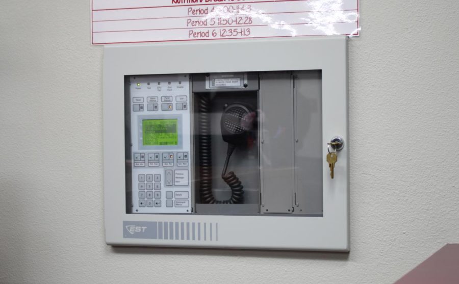 Across Principal Dr. Charles Park’s office, the working fire alarm control panel remains easily accessible in case of an emergency. 