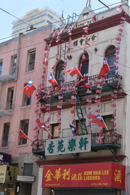 Taiwanese and American flags hang in elaborate display, exhibiting Asian American pride in Chinatown, San Francisco.