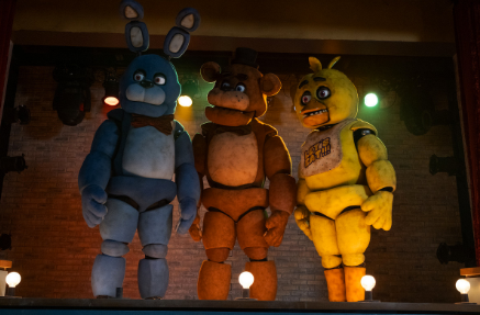 A screencap from the film featuring (left to right) Bonnie, Freddy Fazbear, and Chica