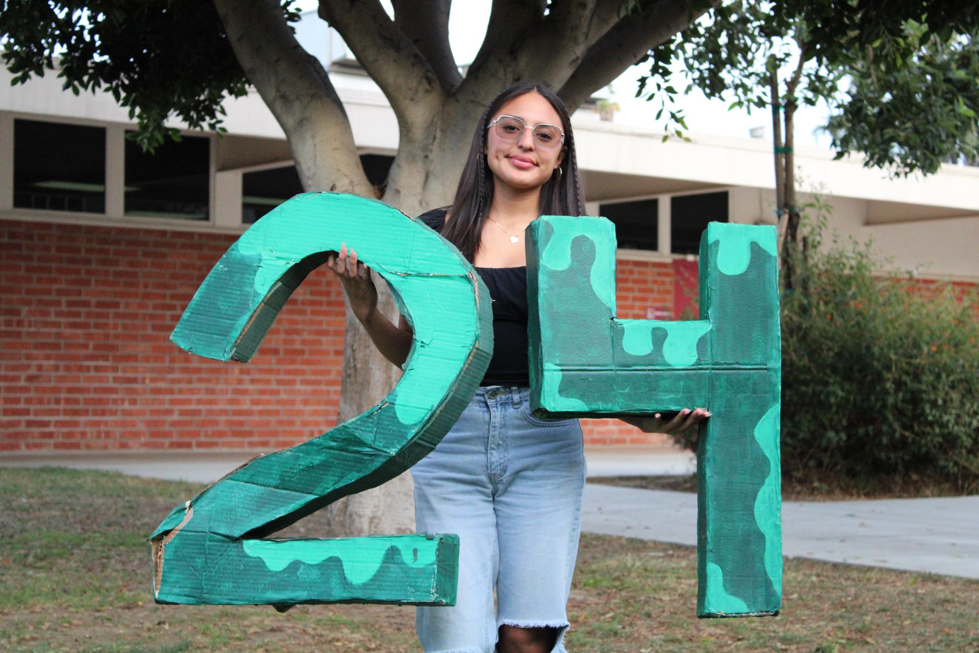 Salazar represents her class’ graduation year’s number in front of the area where the senior class council works on Nov. 13.