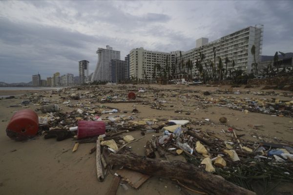 Beach is left trashed after debris from nearby hotels scattered throughout the coast on Oct. 25.