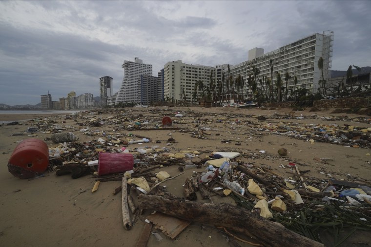 Beach+is+left+trashed+after+debris+from+nearby+hotels+scattered+throughout+the+coast+on+Oct.+25.