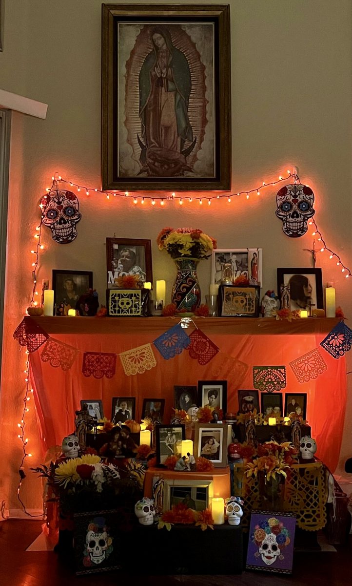 Natali Garcia’s family ofrenda with all of her loved ones. Her grandmother can be seen on the top shelf to the left of the celebratory marigolds. “Dia de los muertos is very special to me because its a day where I can remember all of my loved ones who have passed away.” 