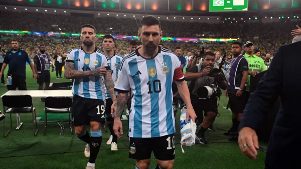 Lionel Messi leads his team off the field as violence sparks up between Brazilians and Argentinians on Nov. 21 in the Maracana stadium in Rio de Janeiro, Brazil. The long historic rivalry between these two countries is recognized for their problematic incidents.

