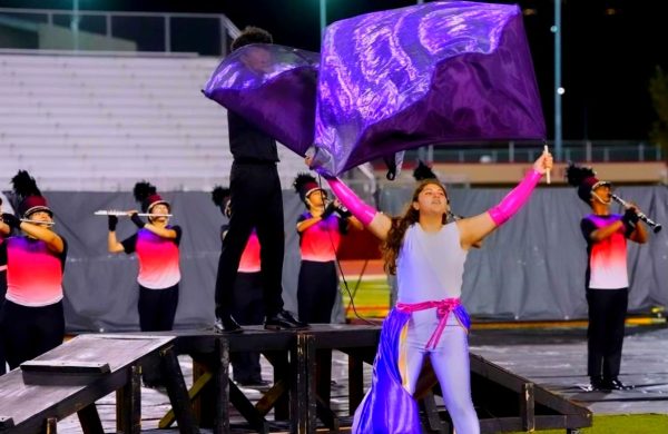 Junior Julia Renteria throws and does tricks with the flags to go with the music of the marching band. She makes sure to focus, have fun, and be in the moment while performing. 
