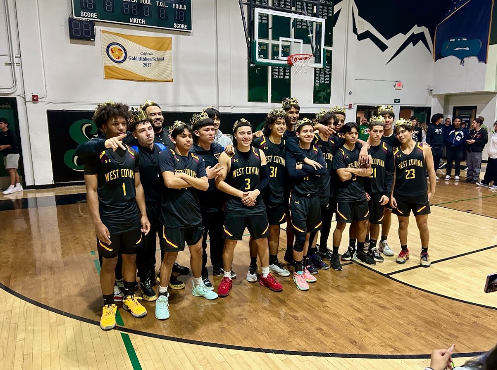 Friends and family gather around to capture a group image of the Kings of Cameron winning squad. The boys take home the victory after losing to South Hills in the last two years.