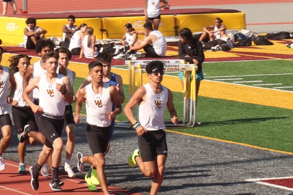 Isaiah Lares (left), Mateo Martinez (center) and Derrick Ynfante (right) compete in the 400, a long lap race, against Charter Oak. Ynfante took the lead as Lares and Martinez followed closely behind him. 
