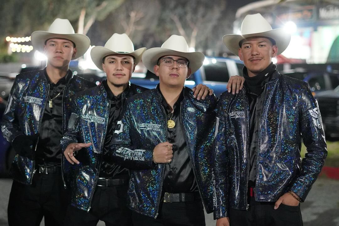 From left to right Joshua Gonzalez, Santiago Roman, Beto Gonzalez, and Julio Gonzalez members of  Grupo Norteño La Seleccion Privada pose for a picture in uniform before performing before taking the stage at the Pico Rivera Sports Arena on January 6 to remember their first big event. They prepare before they perform by saying a prayer and giving each other fist bumps.
“ We tell each other to have fun and, most importantly, look like youre having fun so that the crowd feels your energy,” said Gonzalez.
