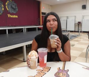 Senior Alexis Barboza drinking her Starbucks coffee in the morning. Her favorite drinks include an Iced Apple Crisp Oat Milk Shaken Espresso, a Strawberry Açaí Refresher, and a Caramel Frappuccino. 