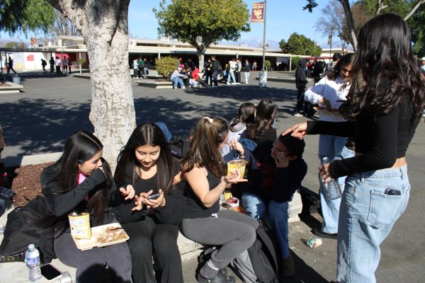 Cheerleaders connecting and sharing their interests. “When we go out we like to eat a lot of food, and we like to sleep,” said Junior Sofia Villegas. 