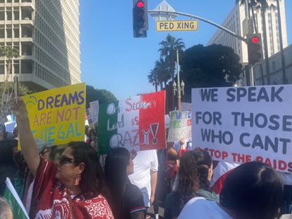 Latino Americans and other protestors gather in downtown Los Angeles yesterday morning. Although some protestors carried signs, others expressed themselves through face paint, playing loud music through speakers or instruments and chanting.