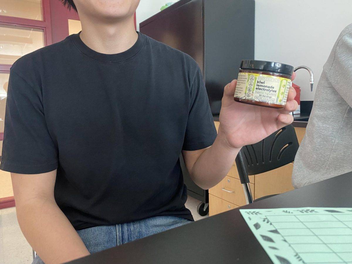 Junior Anthony Cristofaro holds a tub of santacruz electrolytes on Monday. “I got a whole lot better mentally and physically,” Cristofaro said.

