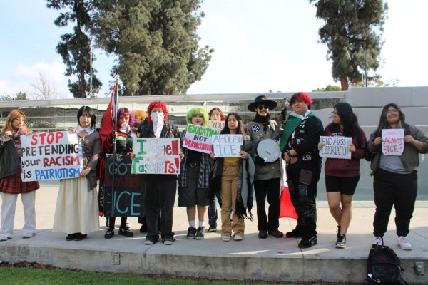 Left to right, seniors Haley Isip, Colleen Yun, Mia Flores, sophomores Raymond Vasquez, Isabella Aparicio, senior Madeline Trejo, junior Monika Ramos, seniors Gabriel Franco, Johnny Altamirano, Sofia Martinez and junior Dannelly Aguilar stand with their signs at West Covina City Hall. These signs allowed students to further express their reasoning for participating in the walkout such as the current issues with deportation.