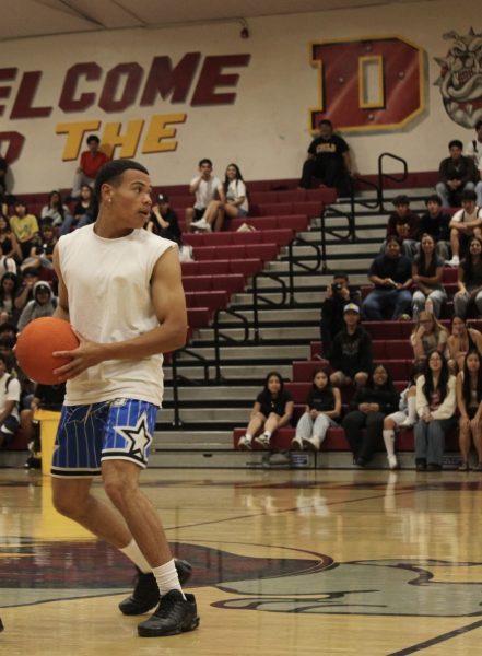 Senior Marcus Mayweather, from the championship team Beemers, looks to eliminate his next target during yesterday’s competition against teachers on April 10. Mayweather hopes to eliminate another teacher to remain undefeated. 