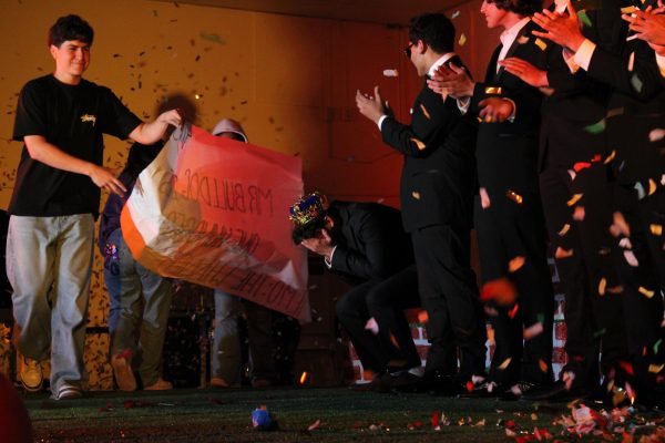 Junior Aiden Estrada collapses in surprise after he was announced the winner of Mr. Bulldog. Estrada spent a year planning, picking songs, making choreography to prepare and has shared how he plans to use his reward money. “I’m gonna buy some pencils, I need pencils because I ran out,” Estrada said.