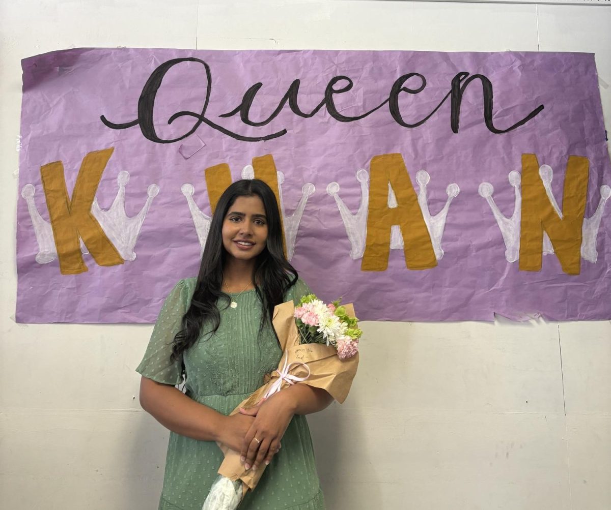 Khan stands in front of a banner that students made and leaves behind a legacy. “She’s very nice and if you need something, she’ll like get it done for you,” AVID student Marcus Hernandez said.