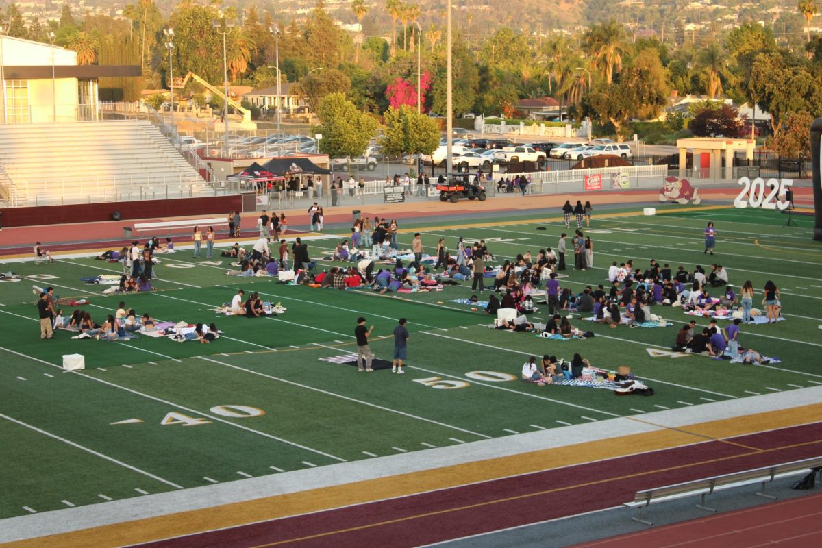 Seniors arrive early for the screening of “Teen Beach Movie.” Vendors sold boba and tacos. 