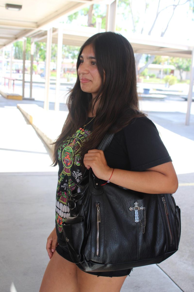 Alexia Lopez, 12, on Friday, Sept. 19 during fifth period with her shoulder bag. Lopez bought it from the TikTok shop. "I love tote bags, I don't like backpacks. They feel very claustrophobic, I don't know, I always felt more athleisure with a tote bag, and I really like leather and I really like jewelry," Lopez said.
