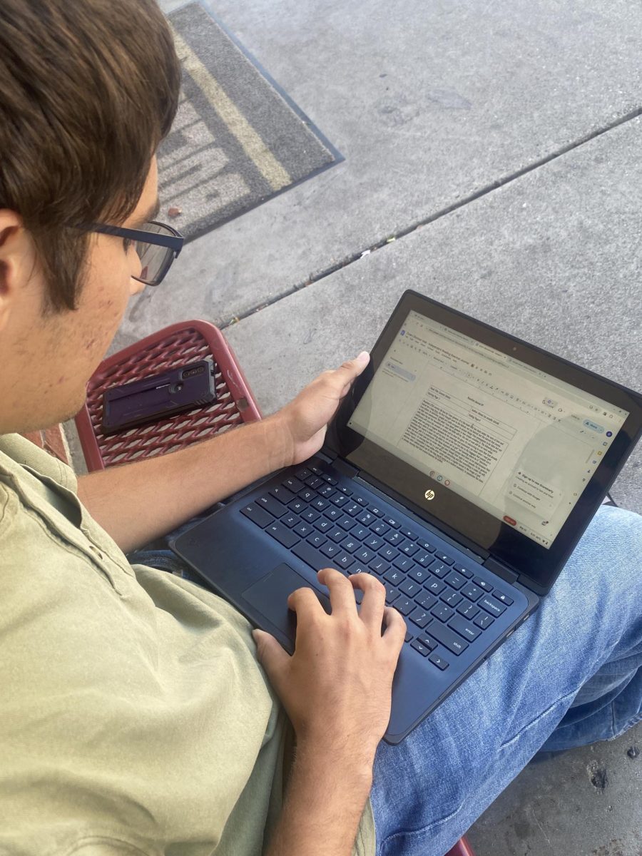 Dylan Olmsted, 12, looks at a Google Doc Sept. 25 to see what errors Grammarly modified . He doesn't use Grammarly anymore. "Grammarly still thinks that there's a bunch of errors,” Olmsted said.