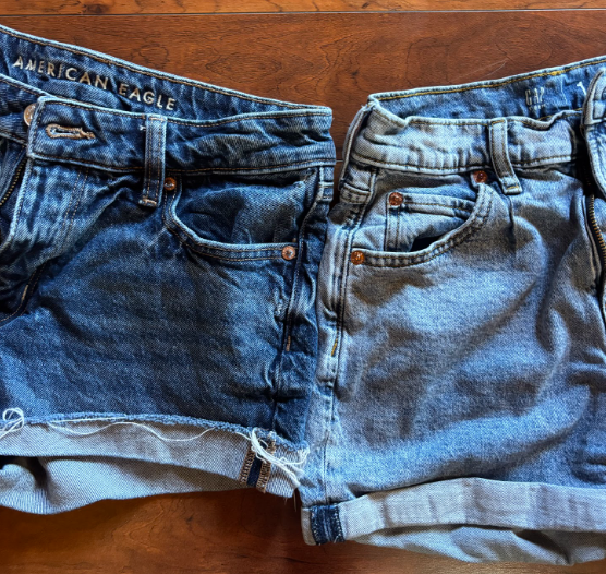 American Eagle and Gap denim shorts are compared as they lay side-by-side. Both brands were compared this summer for their collaboration campaigns, advertisement style and their products.