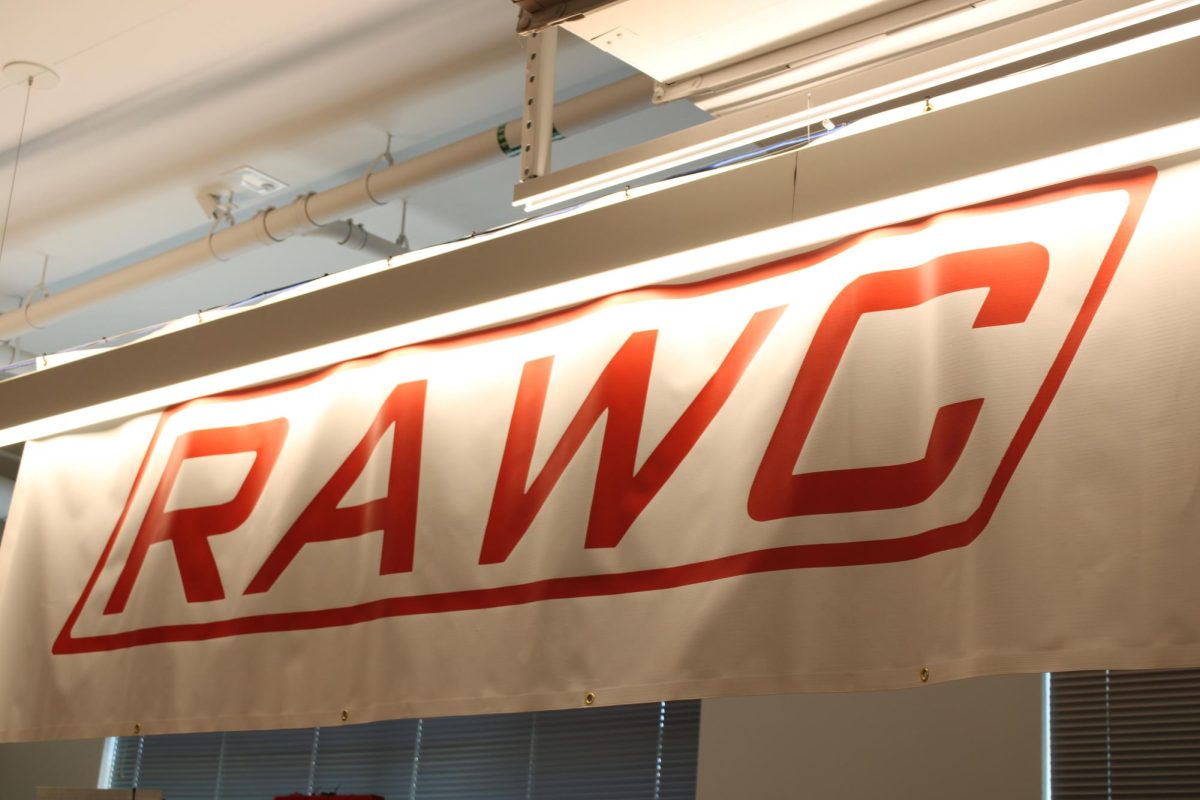 The RAWC banner that Team 968 takes to competitions to represent who they are. The banner is one of many items to represent the team such as posters, flyers and T-shirts that members wear.