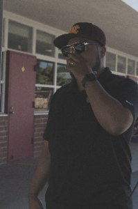 Campus security Jerome Pratt covers his nose as the smell lingers around the M building. The smell affects how he does his job since it makes being posted up there difficult. “It's hard to be in that area. I kind of just make my way to a new section,” Pratt said. 