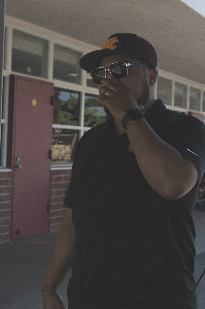 Campus security Jerome Pratt covers his nose as the smell lingers around the M building. The smell affects how he does his job since it makes being posted up there difficult. “It's hard to be in that area. I kind of just make my way to a new section,” Pratt said. 