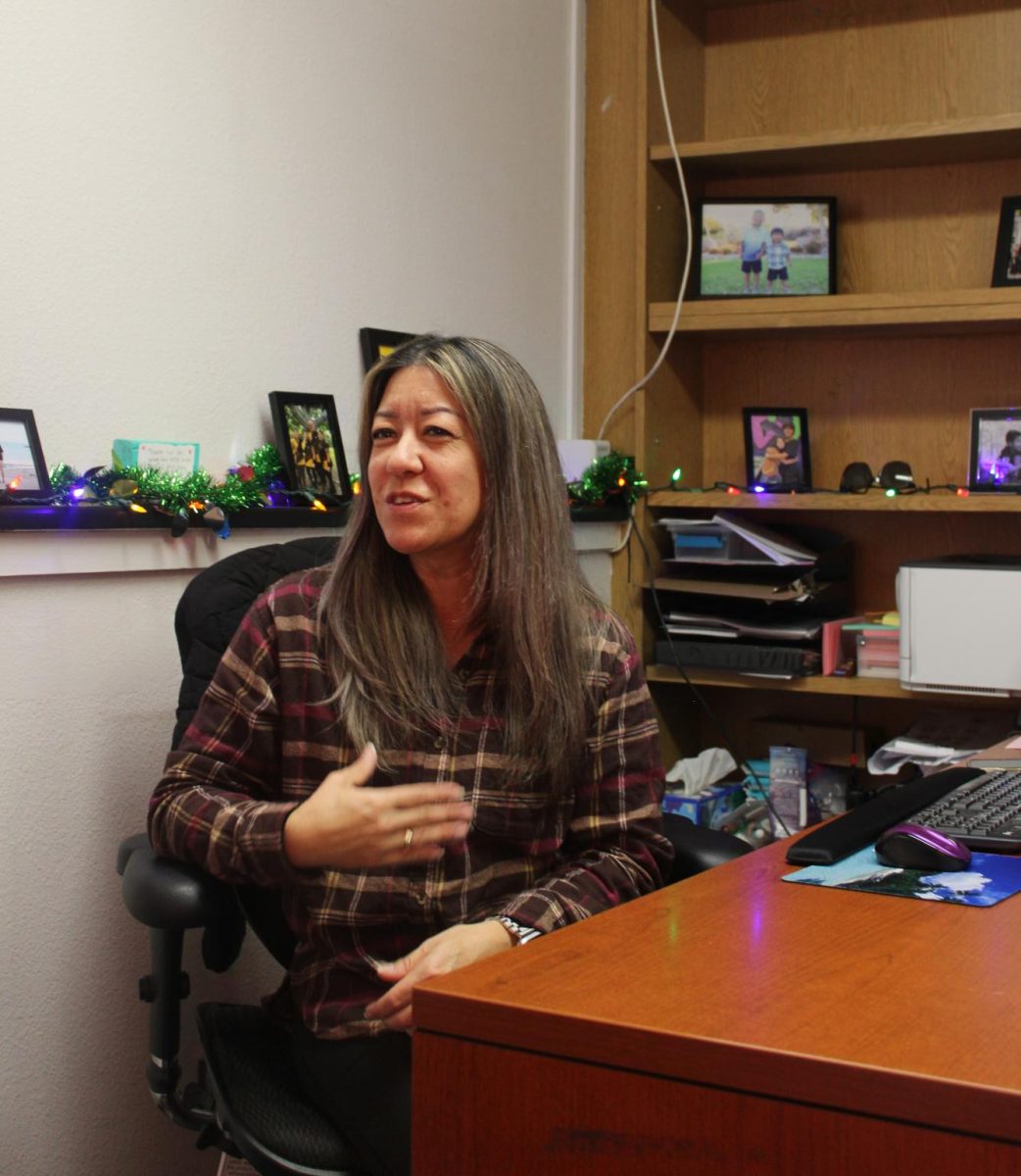 Counselor Kristin Kajikawa talks with a student in her office about college applications. When applying or preparing, counselors can serve as helpful resources. 
