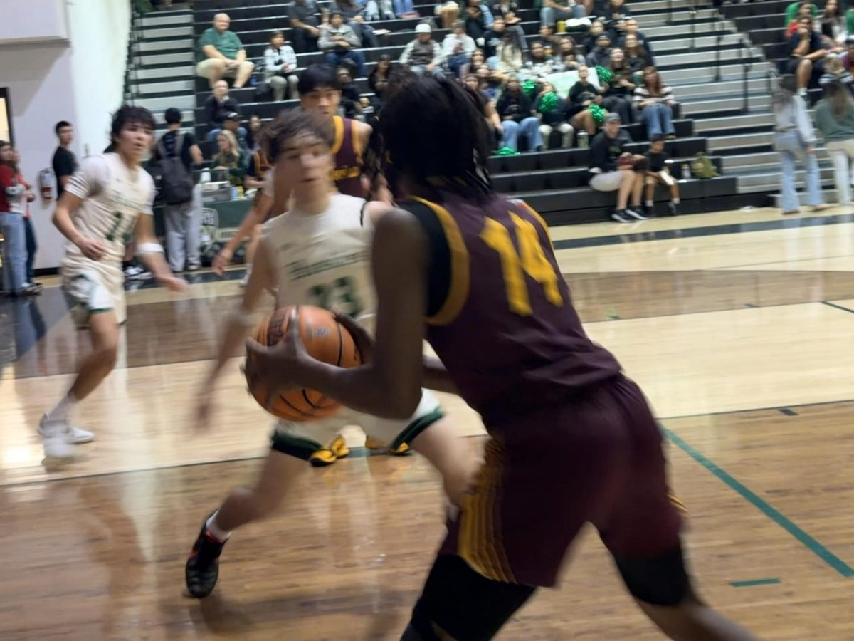 Senior shooting guard Ike Devance Jr looks for open passes. However, seeing there aren’t any, he sprints to the free throw line to shoot for a two. Though he missed his shot, he assisted Senior Jesus Leano for two points.