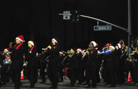 The marching band performs in the annual Christmas parade with the songs they practiced weeks before. They marched the parade route with decorated instruments and performed songs “Sleigh Ride” and “Santa Meets Sousa”.