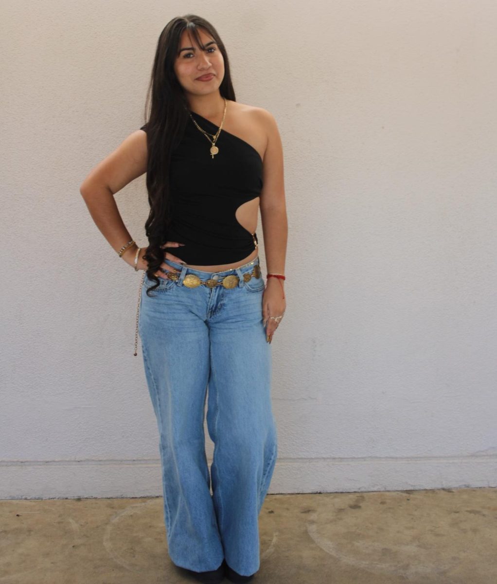 Junior Nayeli Sotelo dresses in an asymmetrical black top and Aeropostale jeans, along with gold accents to accessorize. Sotelo’s style ranges from cutesy to street wear, and every day she plans her outfits based on what her day may consist of and her mood. If she’s feeling down, she tries to counter it, embodying the “look good, feel good” mentality. “I'll actually put a cuter outfit on to feel better,” Sotelo said.