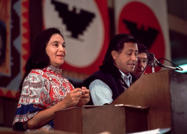 (left to right) Dolores Huerta, Cesar Chavez and Philip Vera Cruz stand together at the podium for the United Farm Workers’ First Constitutional Convention, as Chavez speaks to the crowd. The event was held for three days in Sept. 1973, at the Selland Arena in Fresno, CA, and aimed to formalize the UFW as a “full-fledged” union.
Photo courtesy of Bob Fitch
