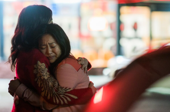 An emotional hug between mother and daughter, Evelyn and Joy Wang, played by Michelle Yeoh and Stephanie Hsu. 
Photo courtesy of A24